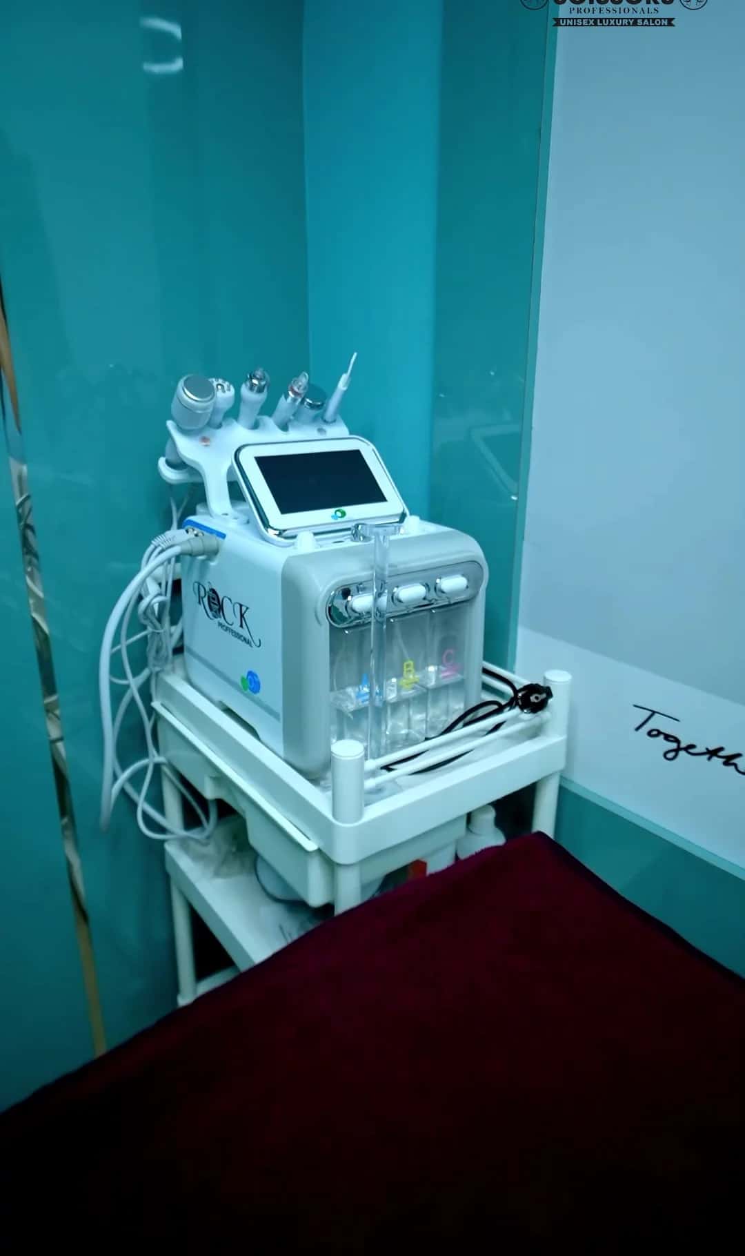 Hydra facial machine on a trolley in the treatment room