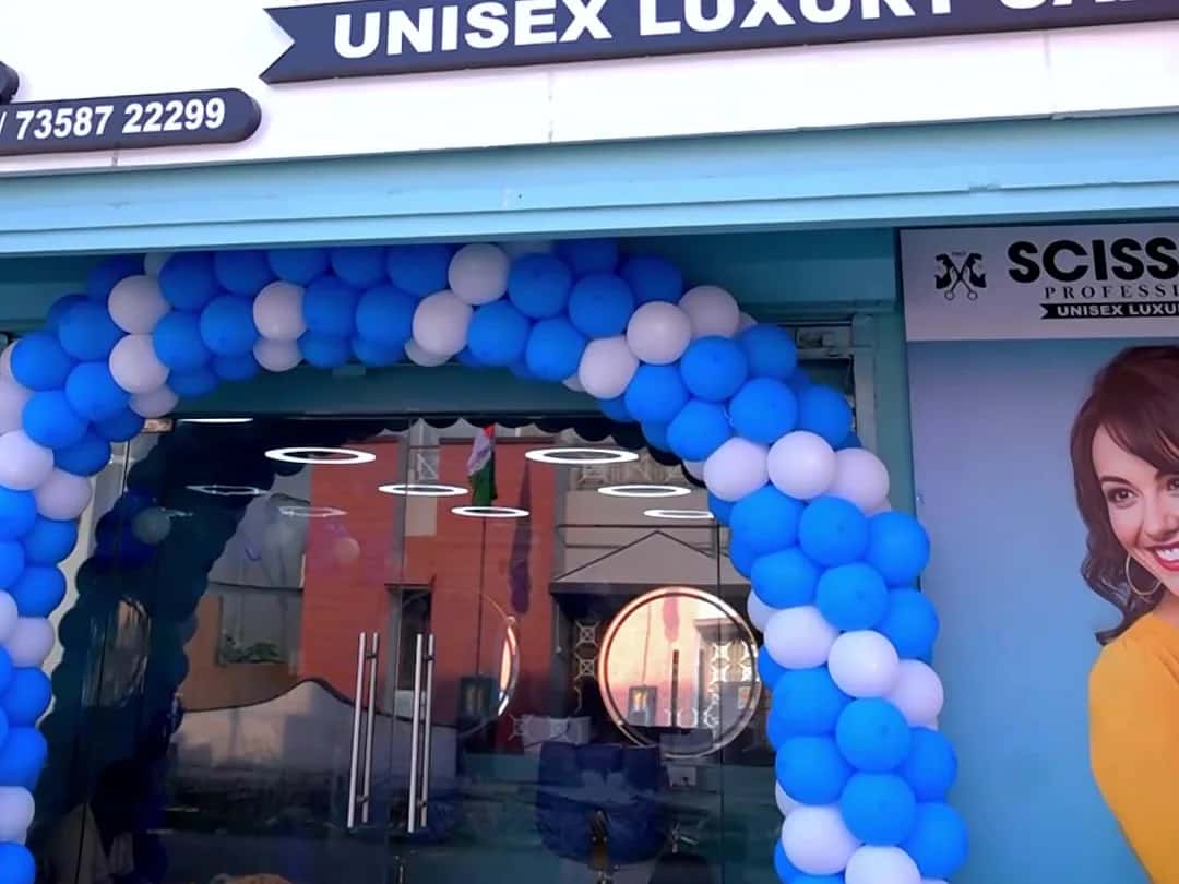Scissors Professionals Unisex Luxury Salon signboard and balloon arch on opening day